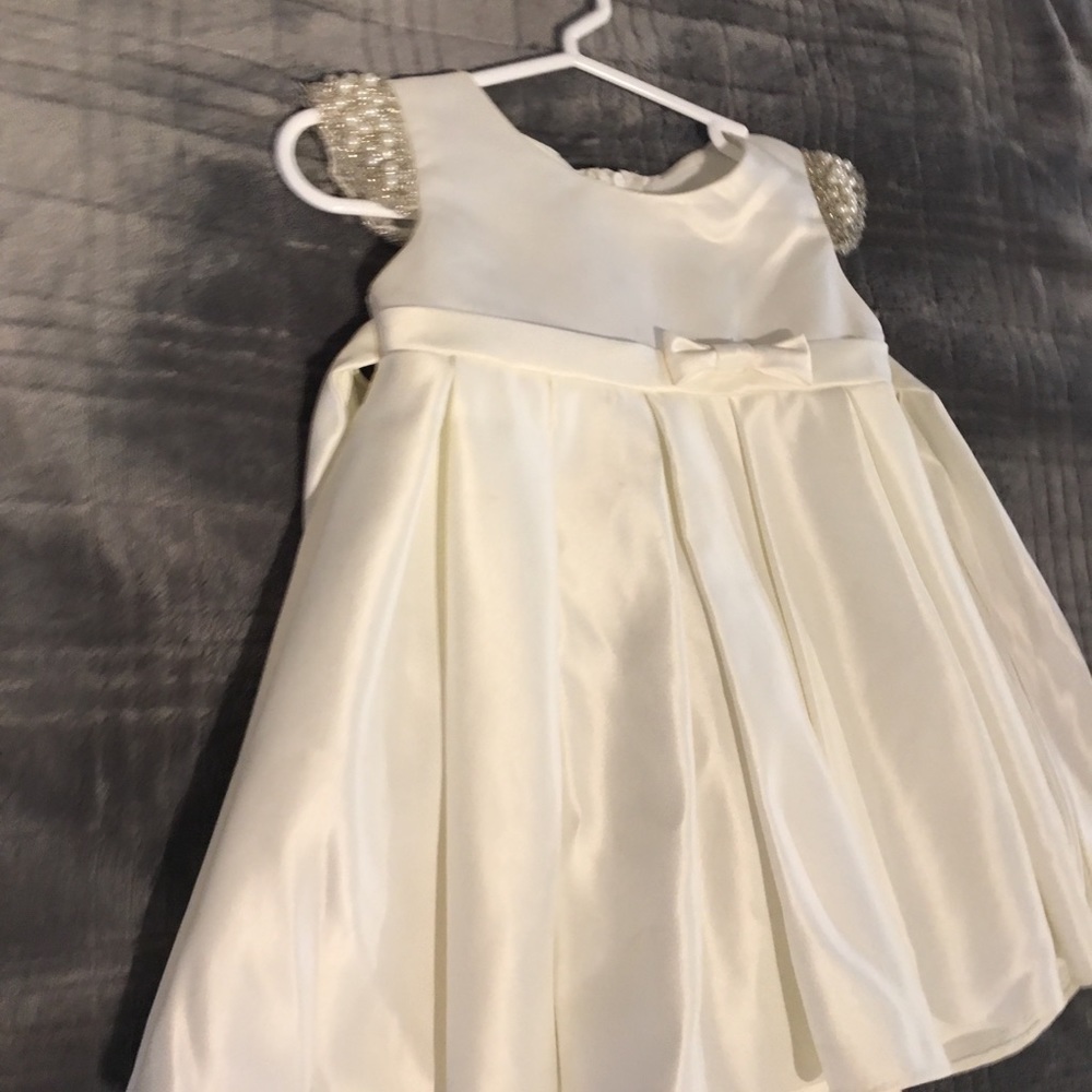 Baby ivory dress with pearl cap sleeves